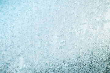 Winter texture background, frost pattern on window. Frosted icy glass
