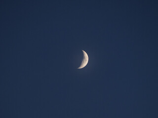 Obraz na płótnie Canvas First quarter moon seen with telescope