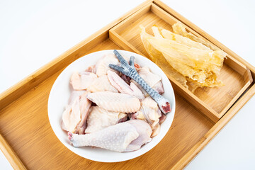 Fototapeta na wymiar Chinese health soup ingredients fresh hen and isinglass