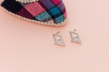 Close up of diamond earrings. space for your text.