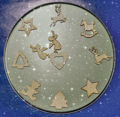 Christmas and New-Year's decorations with handmade brass clock with wooden symbols. Christmas greeting card. Happy New Year. Retro style 