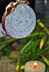 Handmade decorative ball of white threads. New Year's and Christmas card