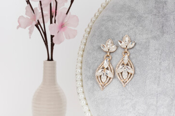 Close up of diamond earrings. space for your text.