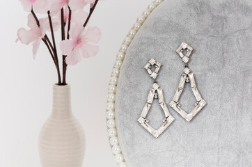 Close up of diamond earrings. space for your text.