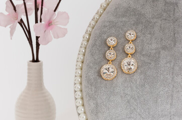 Close up of diamond earrings. space for your text.