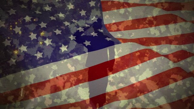 Fireworks and soldier figurine against waving US flag
