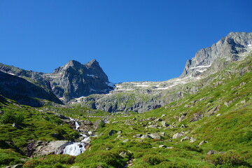 Fototapeta na wymiar Hiking trail GR10 called Pyrenees Traverse leading to the d'Espingo lake deep in the mountains