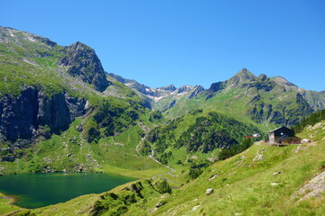 Fototapeta na wymiar Mountain lake called d'Espingo in Pyrenees mountains on a hiking trail GR10