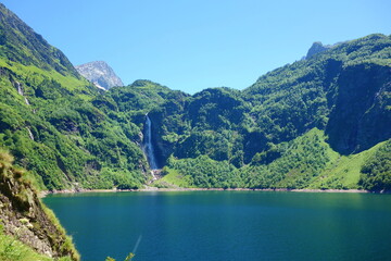 Mountain lake called d'Espingo in Pyrenees mountains on a hiking trail GR10