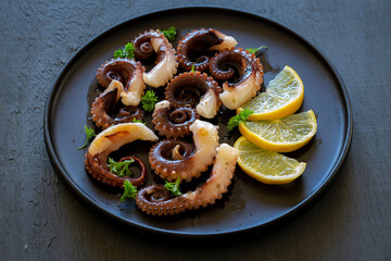 Grilled octopus with lemon and parsley
