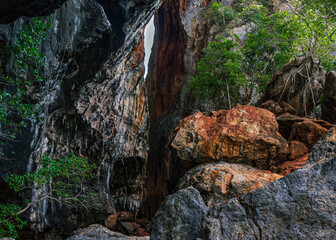 Beautiful colorful rock clif, light between stones