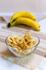 banana a bowl full of dried banana chips. healthy snacks