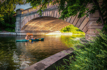 A Saturday evening kayak ride under the bridge at sunset in Minneapolis Minnesota. © nixter