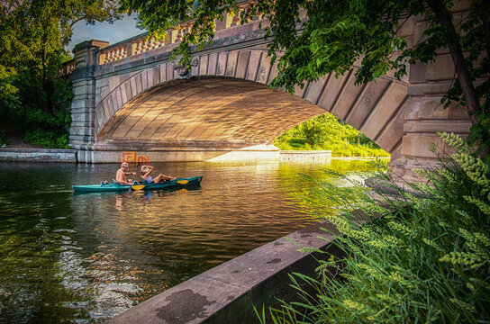 A Saturday evening kayak ride under the bridge at sunset in Minneapolis Minnesota.