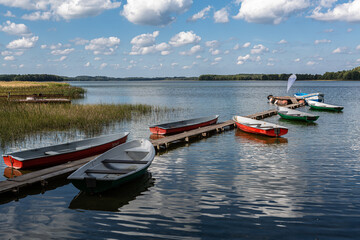 Fototapeta na wymiar Boats and boat moorings on the lake