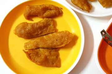 Indian food raw banana bajji or fritter, which is a traditional and popular dish.