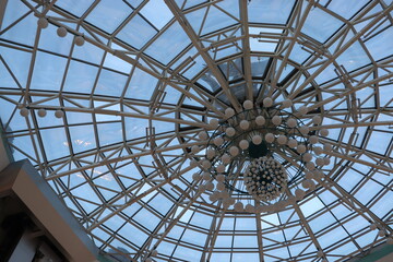 huge lustra hanging on ceiling in mall