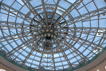 huge lustra hanging on ceiling in mall