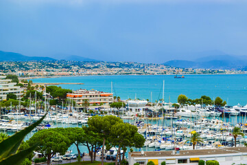 Landscape of the beautiful Marina Baie des Anges on against backdrop of Mediterranean Sea with yachts and sailboats. Villeneuve-Loubet. France.