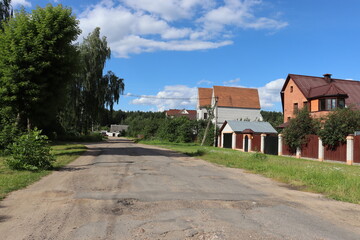 Fototapeta na wymiar rural road with posh cottages view