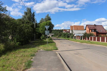 rural road  with posh cottages view