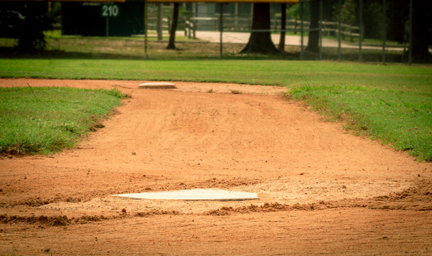 Baseline view of first base from home plate at a baseball field in Conroe, TX.