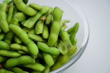A traditional Chinese delicacy in solid color, boiled soybeans in brine. Chinese traditional food boiled soybean.
