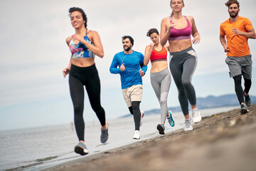 Obraz premium People exercise and jogging for perfect body. Sport and relaxation on the vacation.