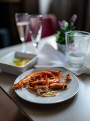 Prawns, glasses of wine and plates