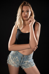 Portrait of beautiful young woman with on black background. Studio Isolated