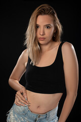 Portrait of beautiful young woman with on black background. Studio Isolated