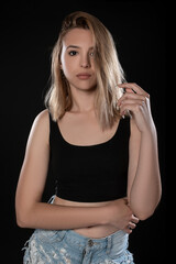 Portrait of beautiful young woman with on black background. Studio Isolated