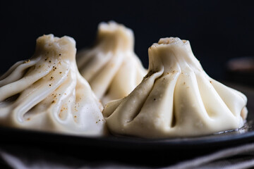 Traditional georgian khinkali dish on stone background