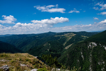 Fototapeta na wymiar Green mountains in Bulgaria and blue sky with white clouds