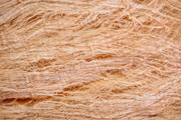 raw, natural mulberry paper handmade in Thailand - background and texture of fibers