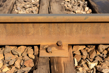 Rails and old wooden sleepers on the railway in Russia.