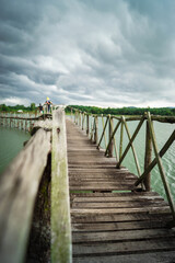 Fototapeta na wymiar wooden bridge over the river