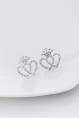 Close up of diamond earrings. space for your text.