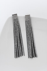 Close up of diamond earrings. space for your text.