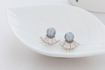 Close up of diamond earrings. space for your text.