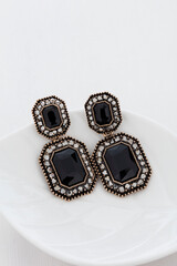 Close up of diamond earrings. space for your text.
