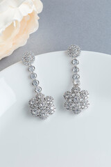 Close up of diamond earrings. space for your text.