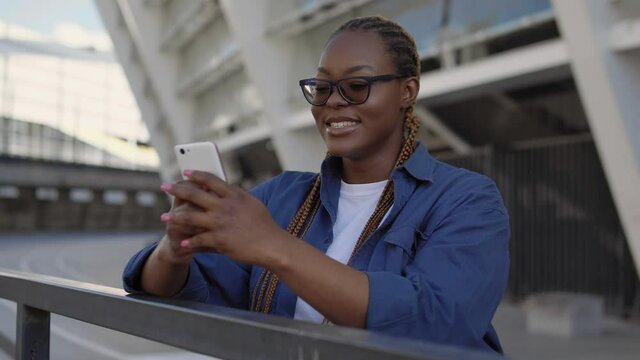 Happy Black Woman Surprised With Application For Online Goods Order On Phone