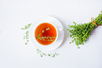herbal tea with thyme on the white background