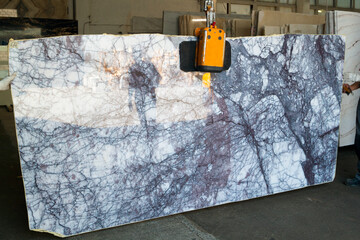 Displaying a Colorful marble slab in the store showroom before selling