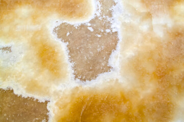 Onyx texture background of natural stone with polished yellow streaks. marble texture used for indoor and outdoor home decoration