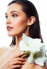 Fototapeta premium young pretty woman with Amarilis flower closeup isolated on white macro