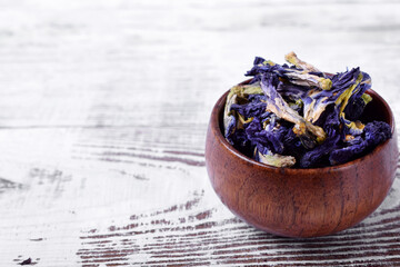 Fototapeta na wymiar Dry blue anchan tea on the white wooden table