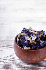 Dry blue anchan tea on the white wooden table