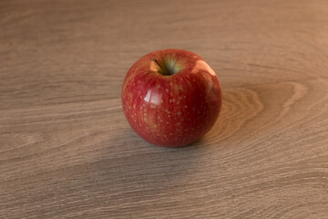 red apples on wooden table